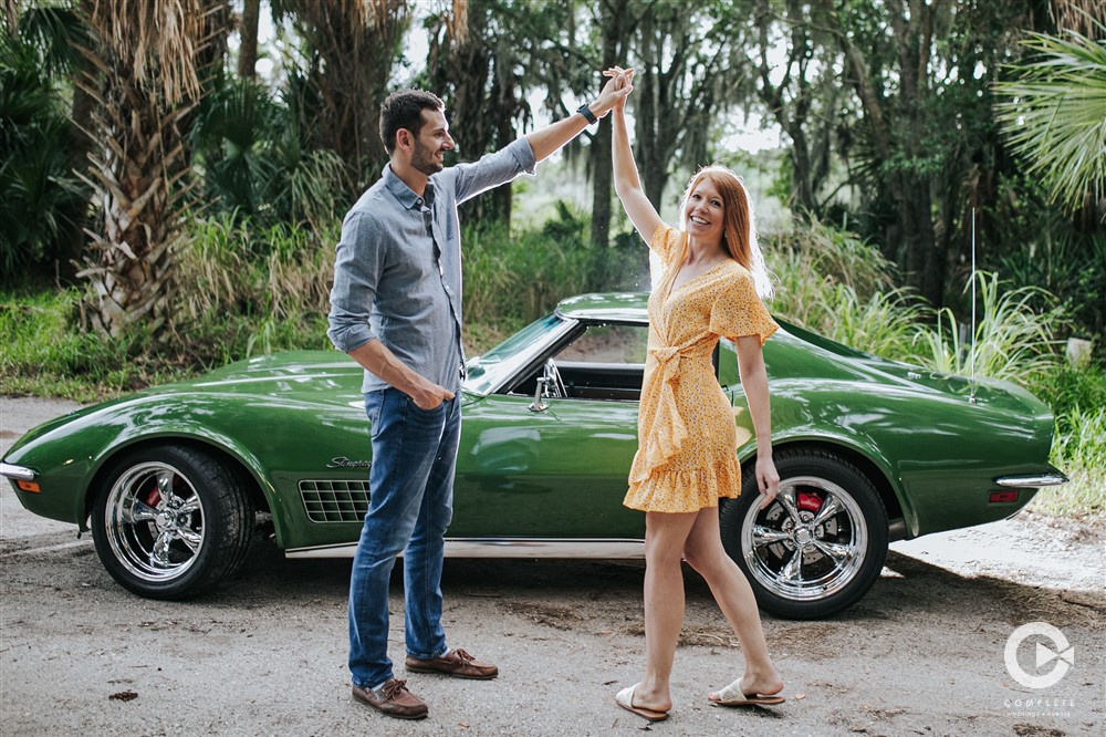 Dancing together in front of vintage car in Florida