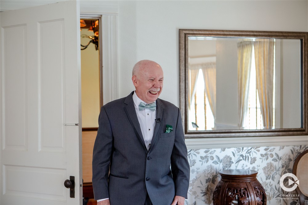 Father of the bride getting to see his daughter during her wedding day for the first time