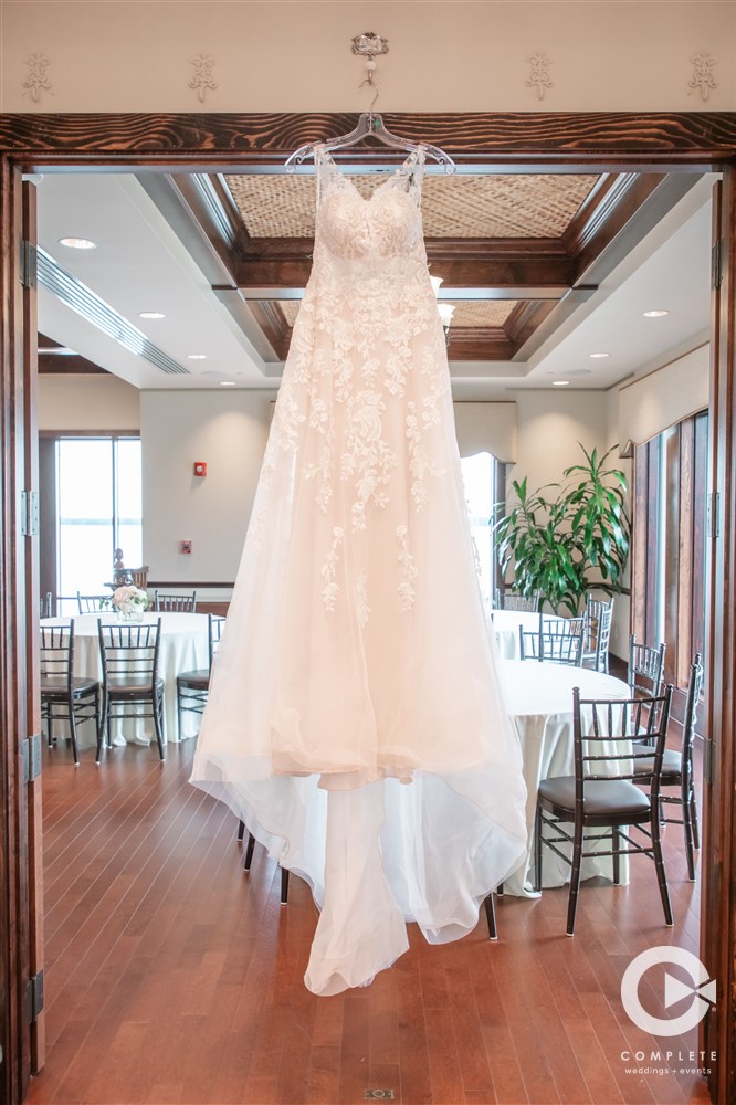 Wedding dress hanging up at Tavares Pavilion on the Lake