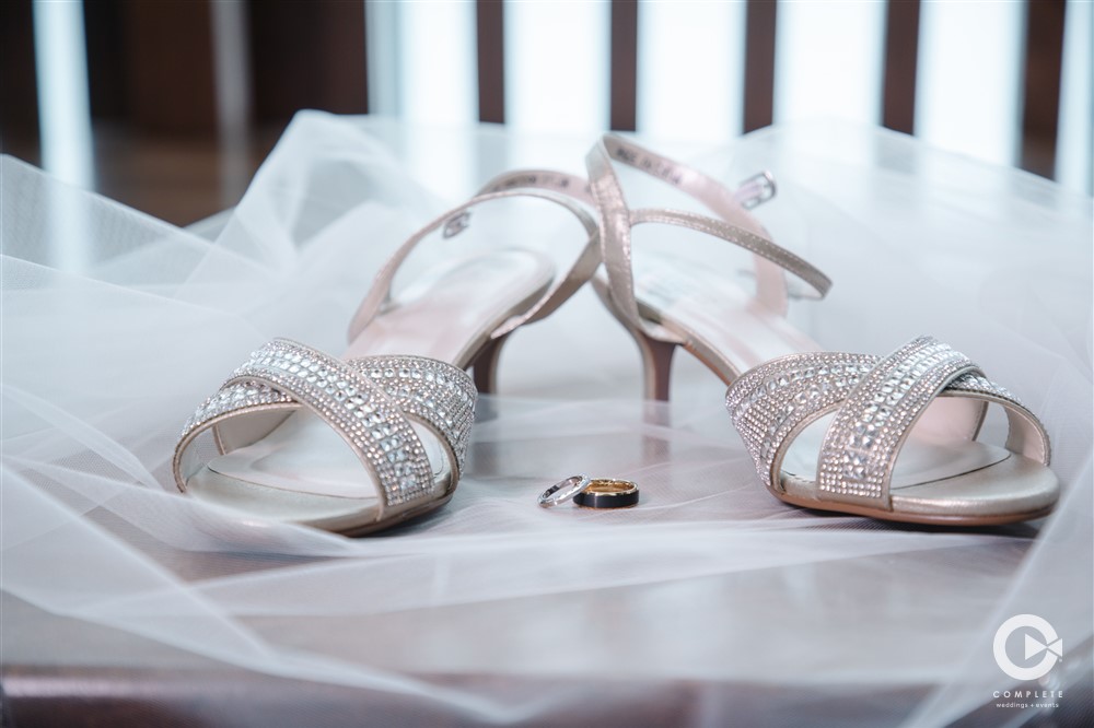 Wedding shoes on a wedding veil during Tavares Pavilion on the Lake wedding