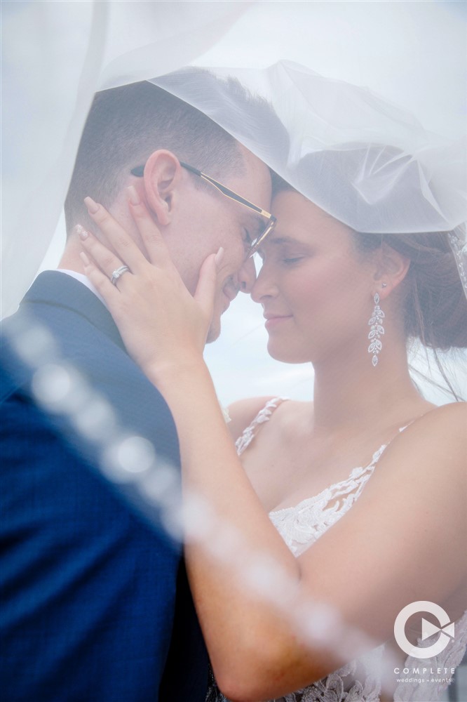 Bride and groom close together at Tavares Pavilion on the Lake wedding beautiful shot