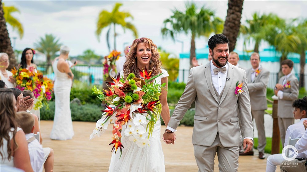 Couple walking together outside after their ceremony at Margaritaville Resort Orlando