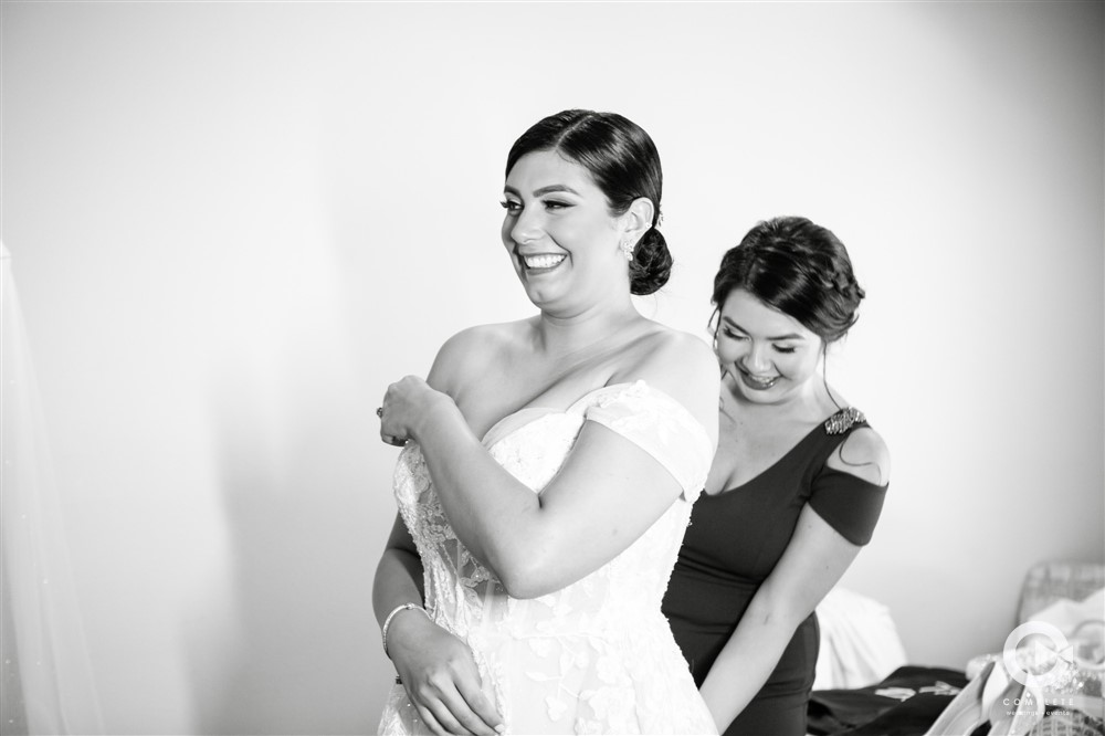 Bride getting ready with her mother in black and white wedding photo