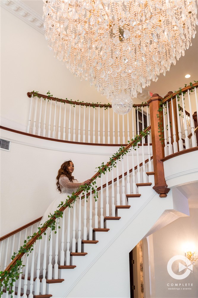 Bride walking up the stairs at Luxmore Grande Estate in 2021