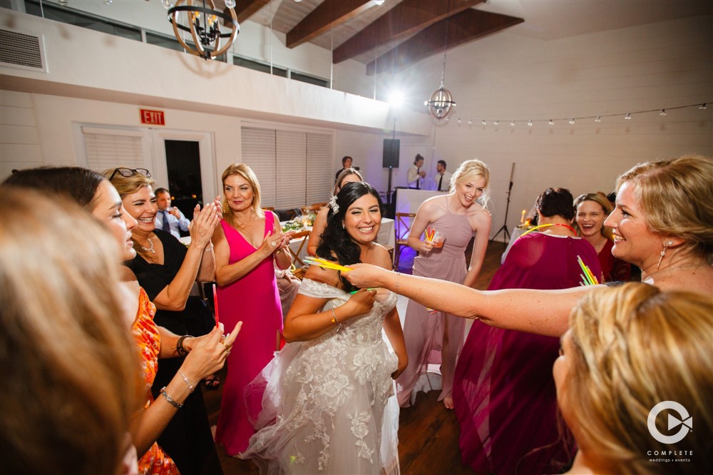 Bride dancing at her wedding reception at The Garden Villa during Fall wedding