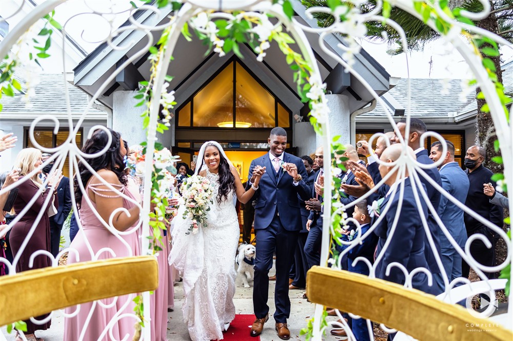 Bride and groom walking to their wedding carriage beautiful wedding shot