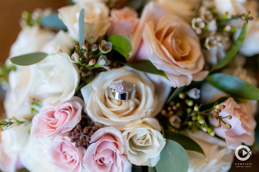 Wedding ring in flower petals amazing wedding shot detail photo at Bella Collina