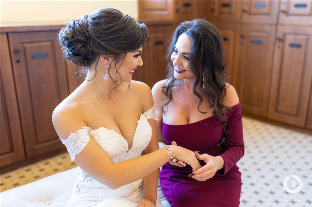 Bride and bride's mother sweet photo at Bella Collina mother helps her daughter get married
