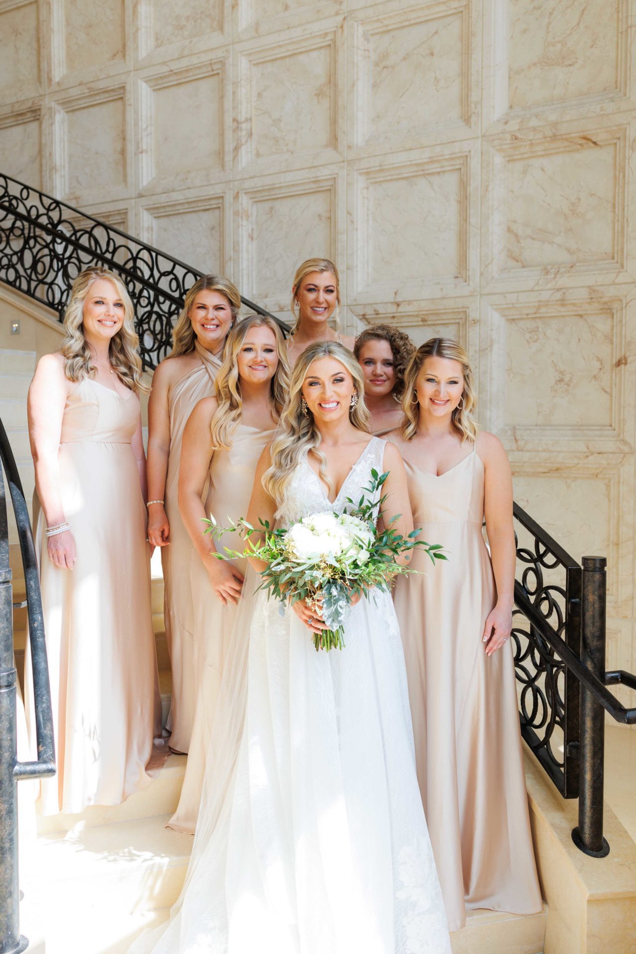 Bride with bridesmaids on steps at beautiful Downtown Orlando wedding photo taken by David A. wedding photographer