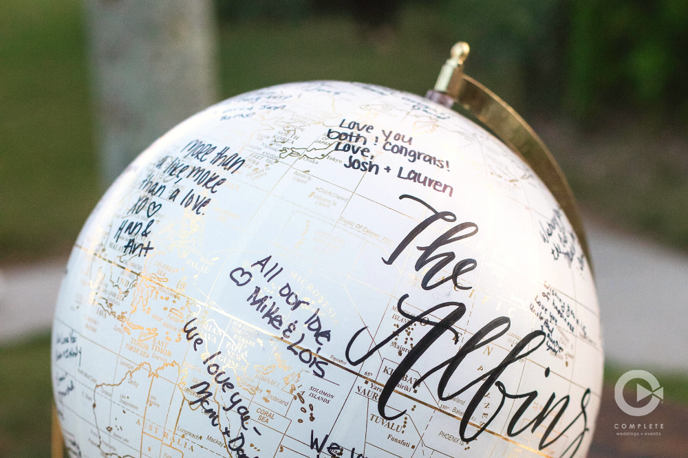 A globe is used for guests to sign at an Orlando, FL Wedding