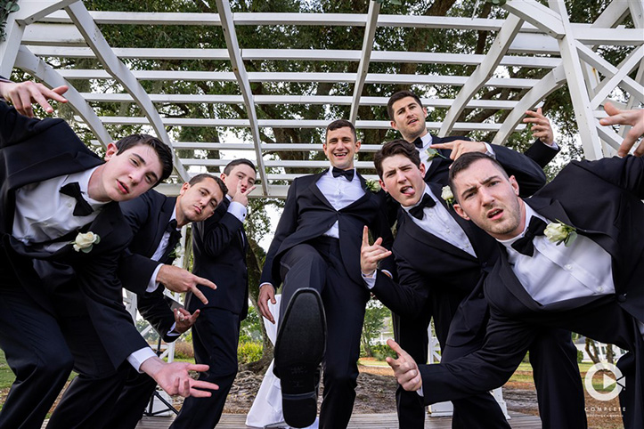 Groomsmen having fun with their Orlando, FL photographer at Tuscawilla Country Club