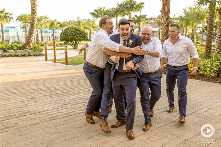 Groom and groomsmen having fun at Margaritaville wedding in Orlando, FL