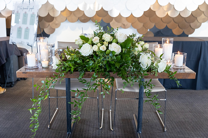 Head table florals with greenery as a spring wedding trend in Orlando, FL