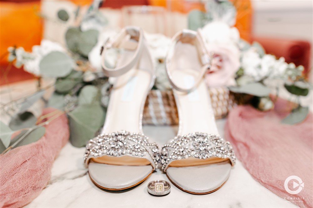 Styled shot of wedding shoes sparkly at Venue 1902 before bride walks down the aisle.