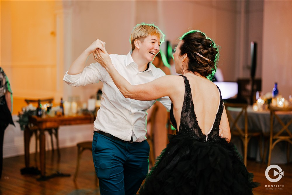 Bride dancing with friend during her July wedding at Venue 1902