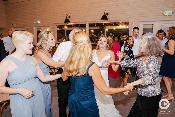 Bride and family dancing together at The Mulberry in New Smyrna Beach