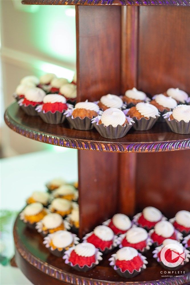 Cupcake tower with frosting on each one at Garden Villa