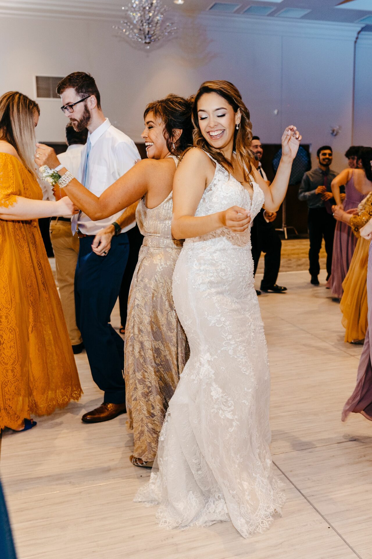 Bride dancing with her friends during her wedding at Tuscawilla Country Club