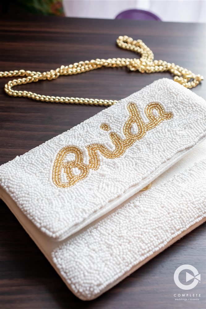 Makeup bag with golden accents for New Years Eve wedding