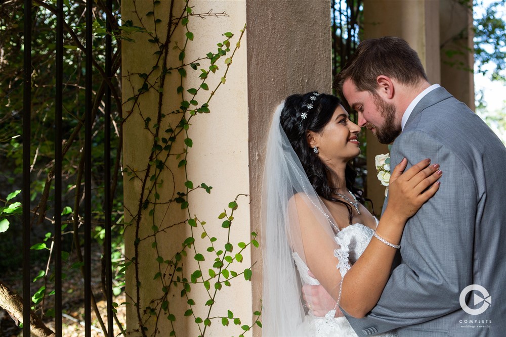 Bride and groom leaning in for a kiss during their Lake Mary Event Center wedding