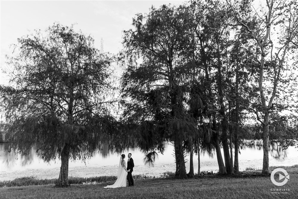 Wedding reception at Lake Mary Events Center bride and groom far away shot black and white.