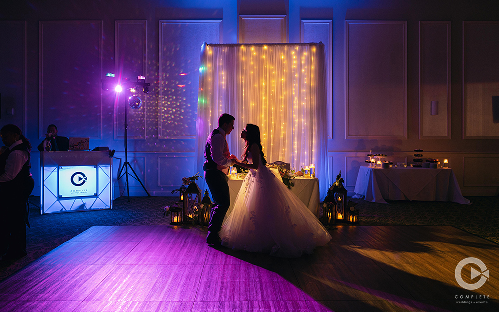 Bride and groom dancing at their wedding reception while DJ plays music amazing wedding photo in Orlando