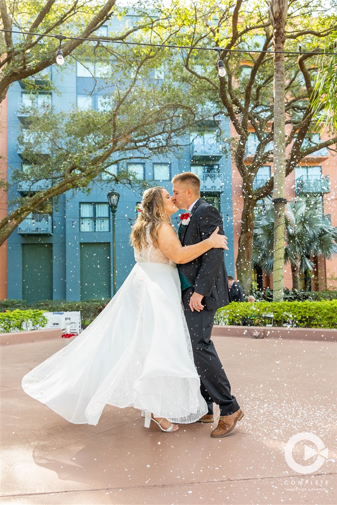 Bride and groom embrace during their winter wedding in Florida at Disney World