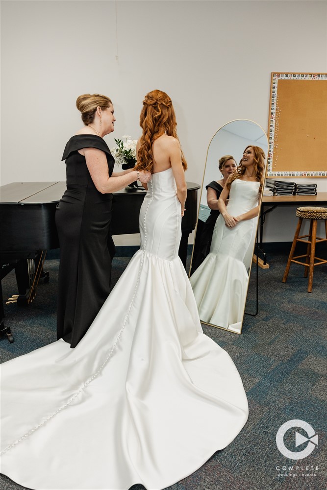 mother and bride getting ready