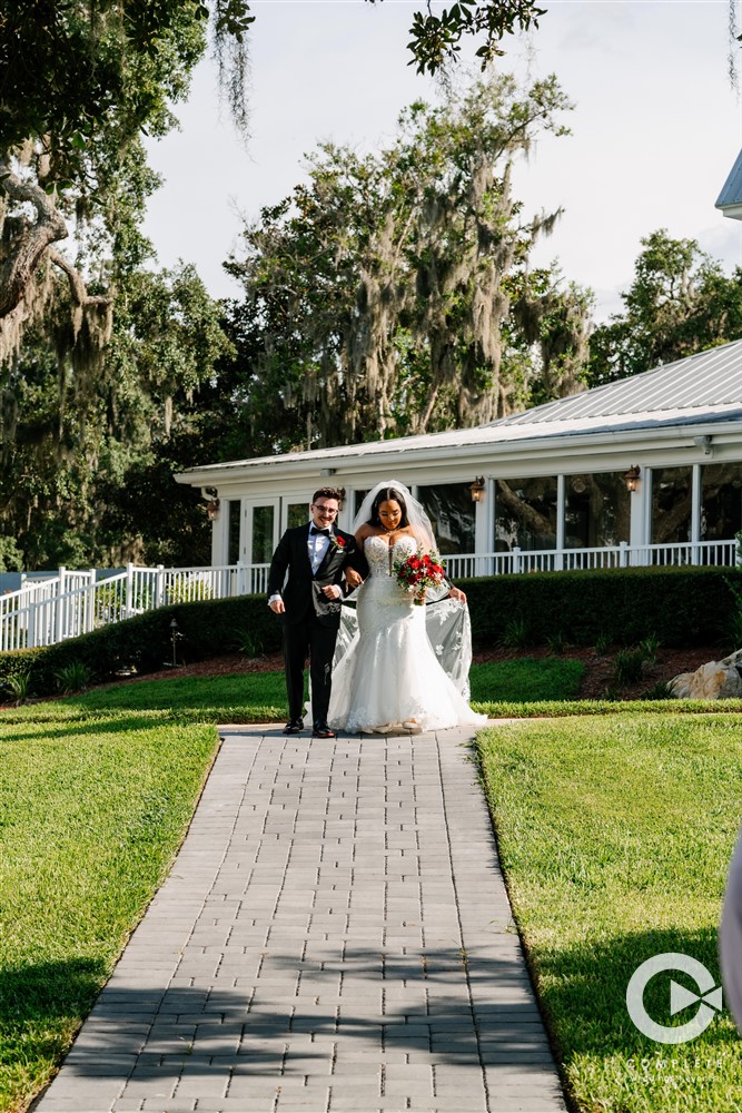 groom walking the bride down the aisle