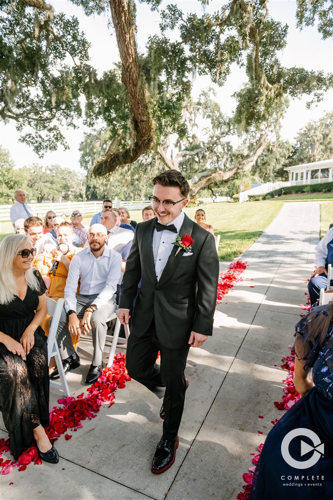 groom walking down the aisle