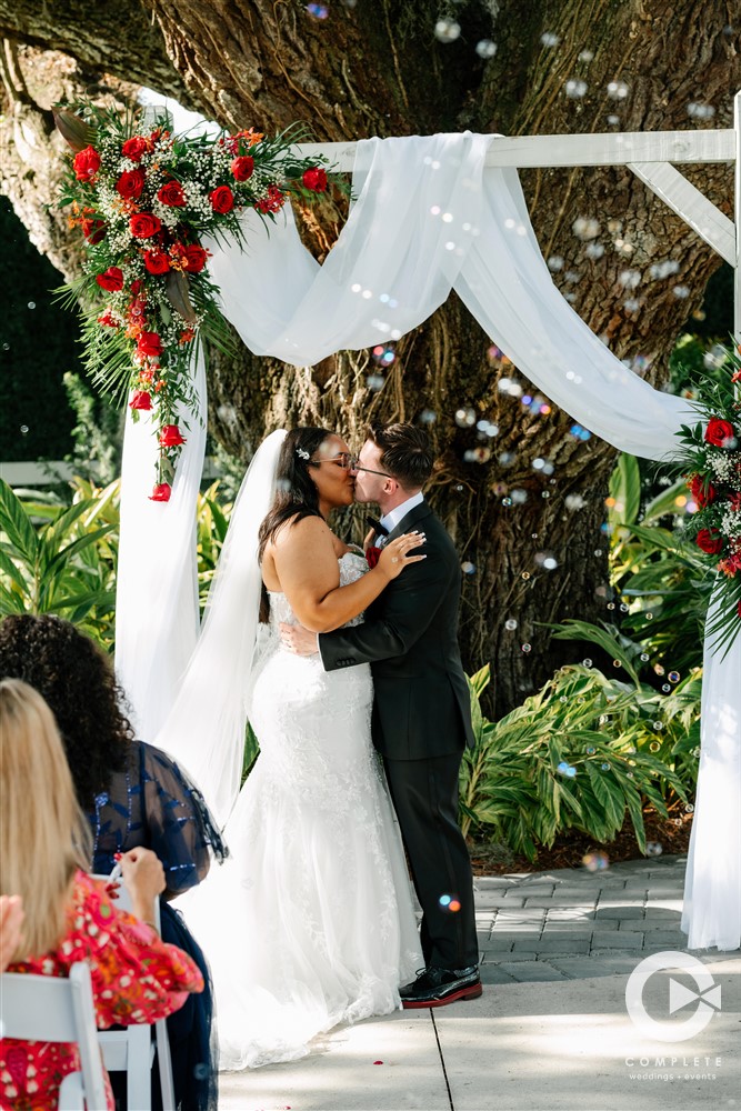 bride and groom kiss