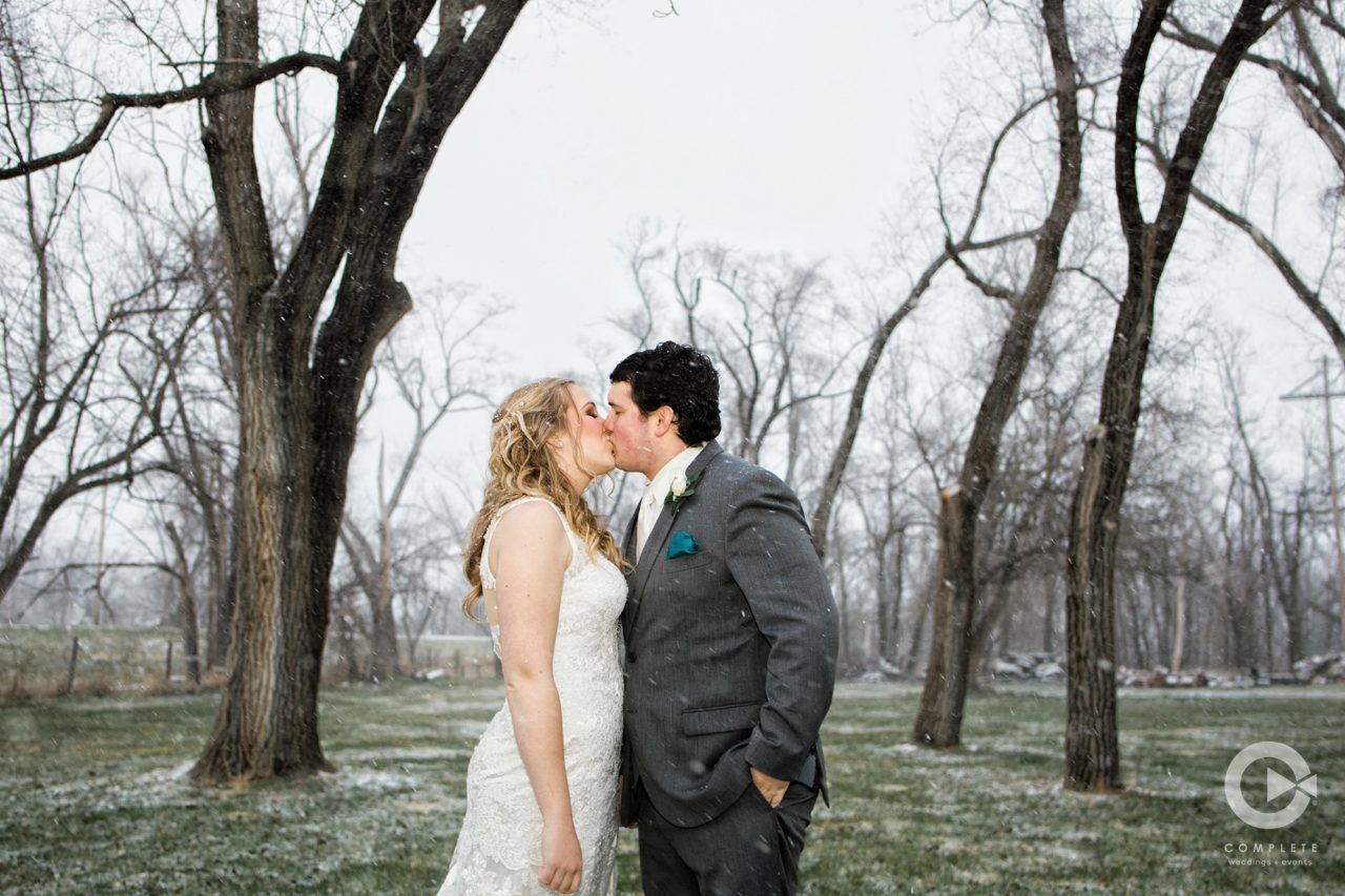 bride and groom kiss