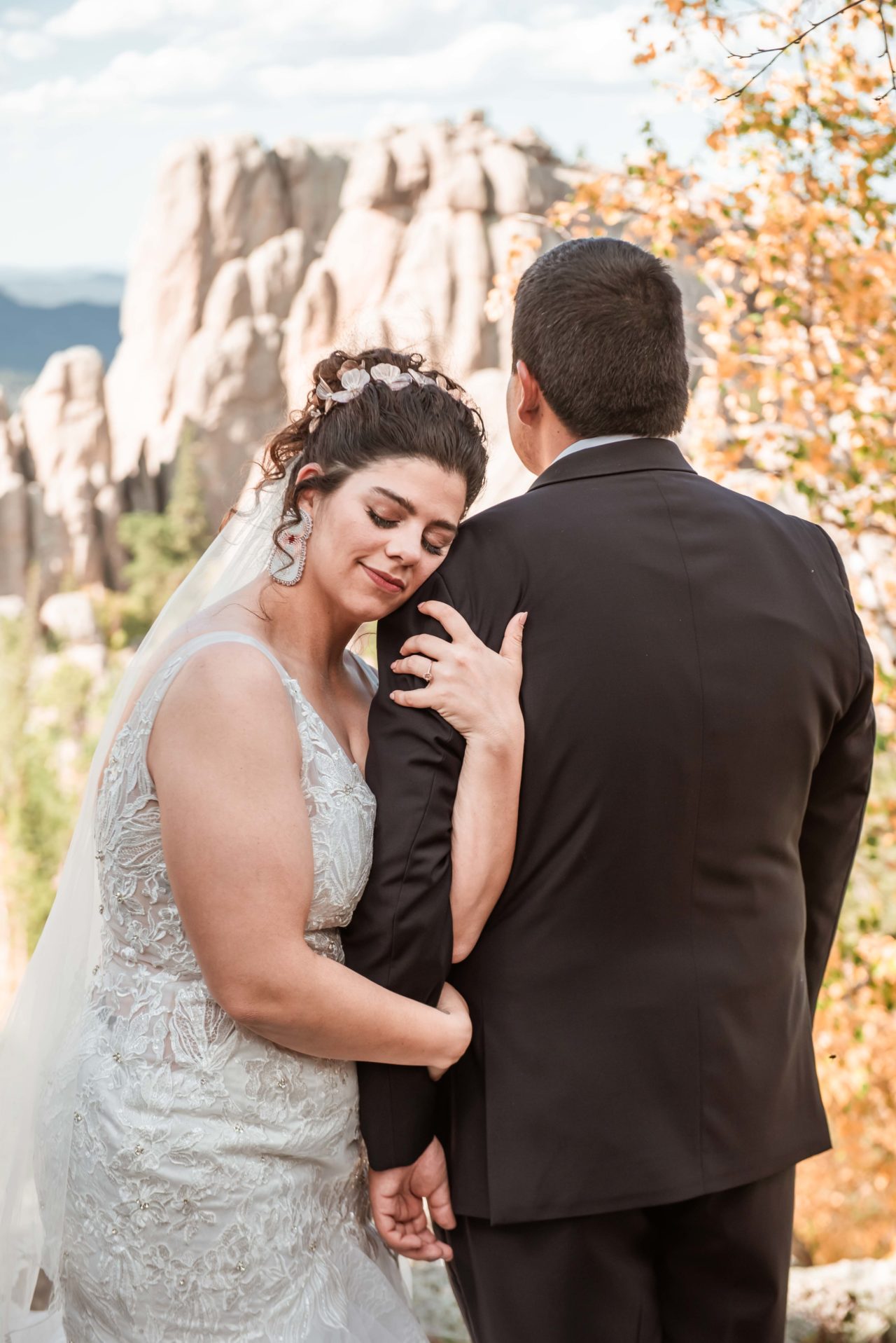 Bride and groom on mountain top