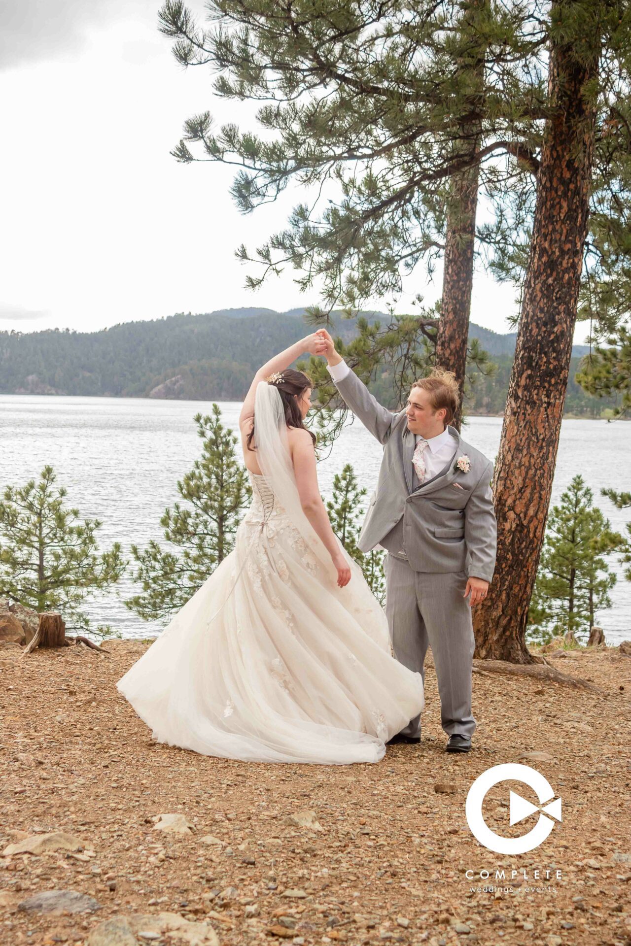 Professional wedding photographer near Rapid City - groom spinning bride