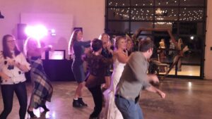 Professional DJ leading the group dance