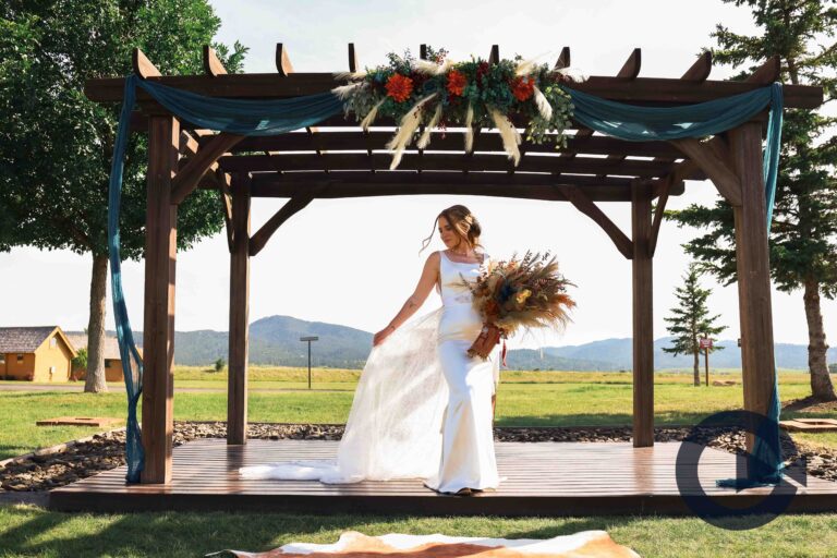 black hills fall wedding inspiration at elkhorn ridge ceremony arch teal and rust