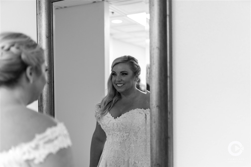 Bride Looking in Mirror