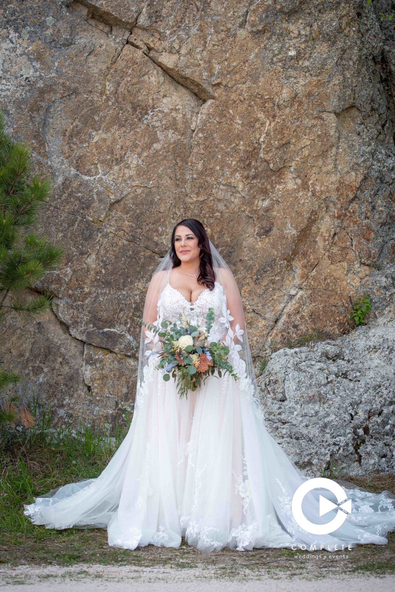 Bride in front of a granite wall South Dakota