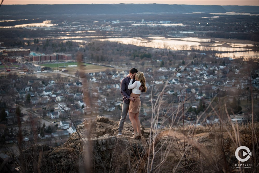 Couple taking photo while sun is setting on them beautiful shot during engagement shoot