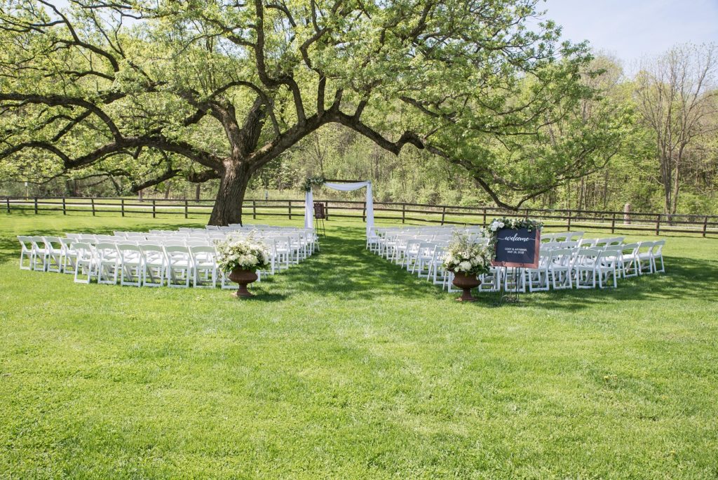 Spring Wedding Ceremony on the Lawn of the Mayowood Stone Barn in Rochester, MN
