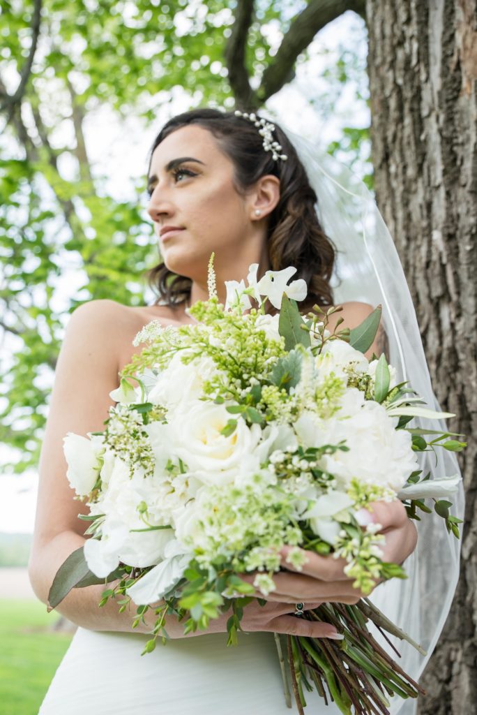 Portrait of the Bride with her Bouquet at the Mayowood Stone Barn in Rochester, MN