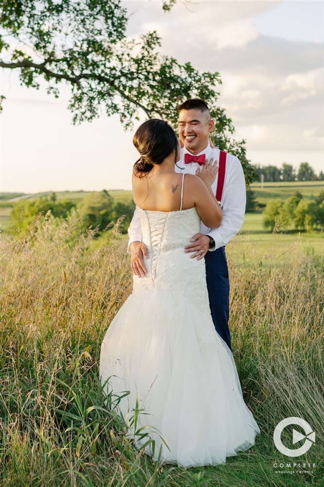 Couple dancing in a field in Minnesota on wedding day