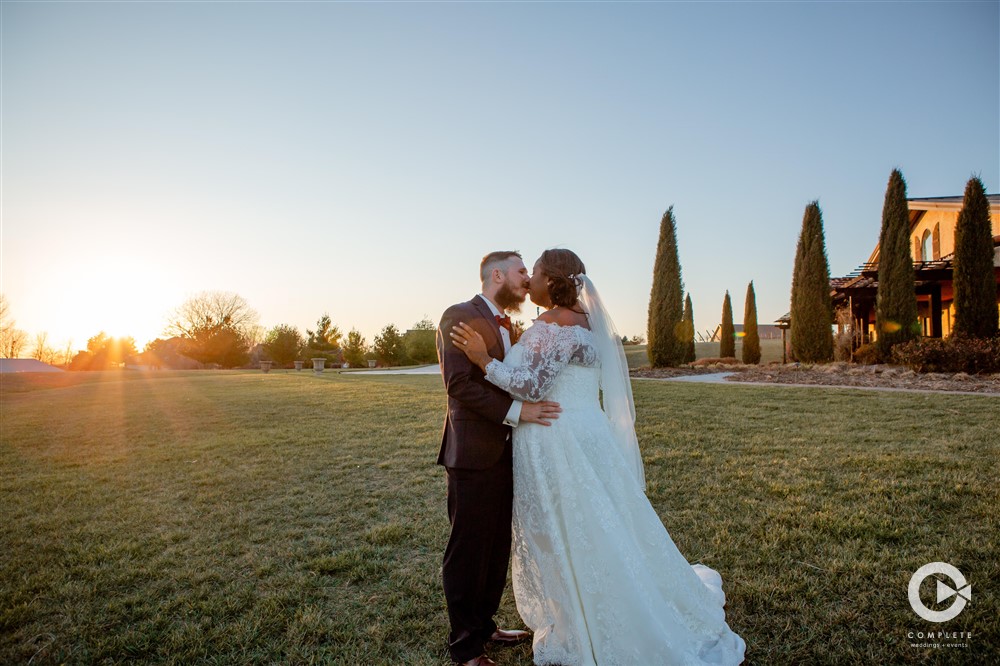 Outdoor wedding photo while sun sets at a Rochester Minnesota wedding reception