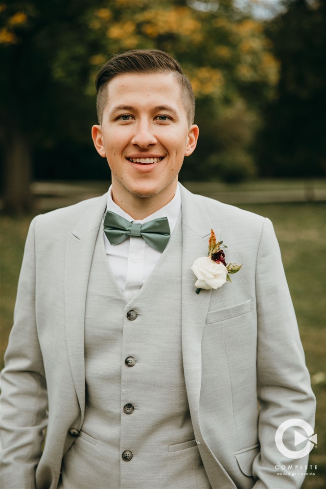 bow tie in green and gray suit