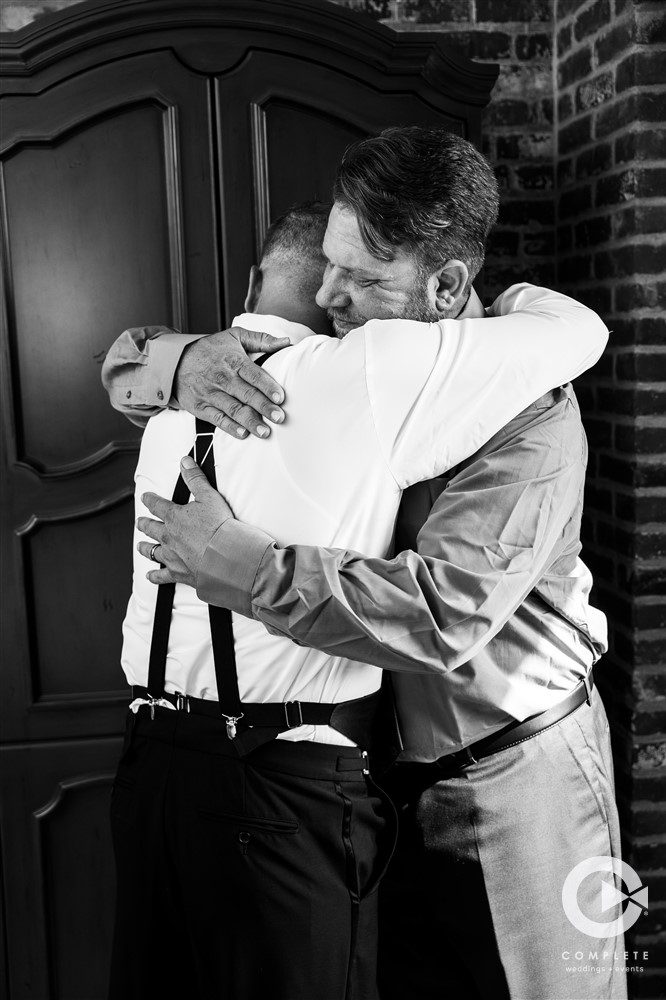 groomsmen hug