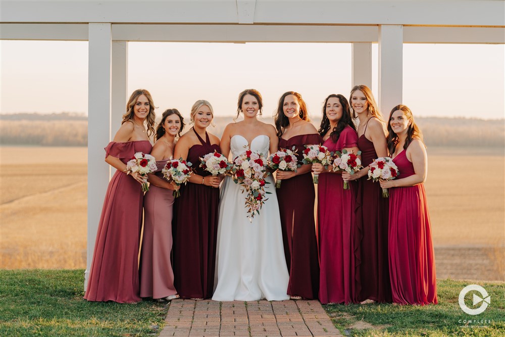 Smiling bridal party in fall dress