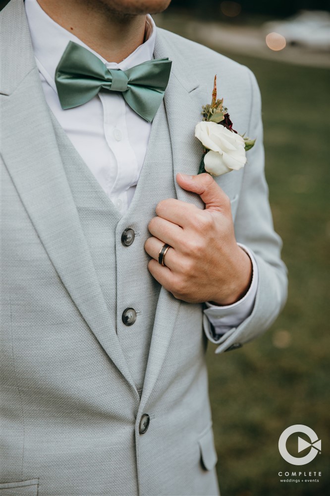 groom attire in green
