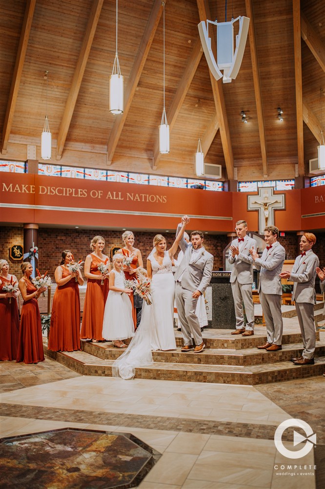 bride and groom at altar