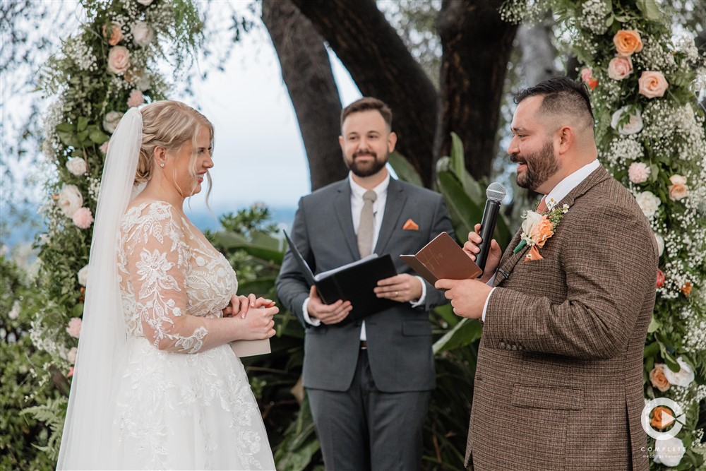 bride and groom exchanging vows