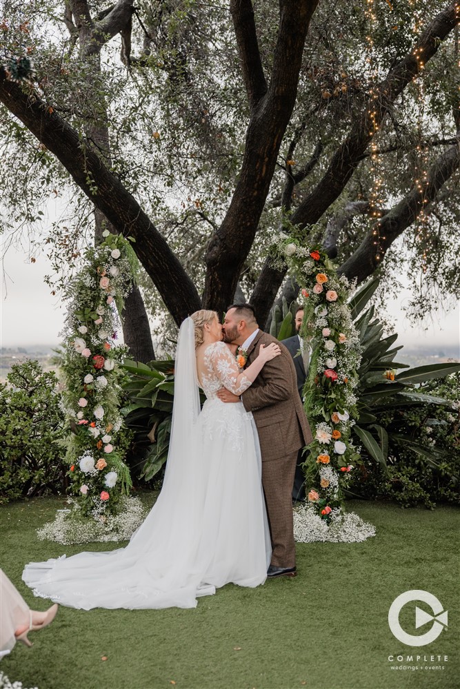 bride and groom ceremony kiss